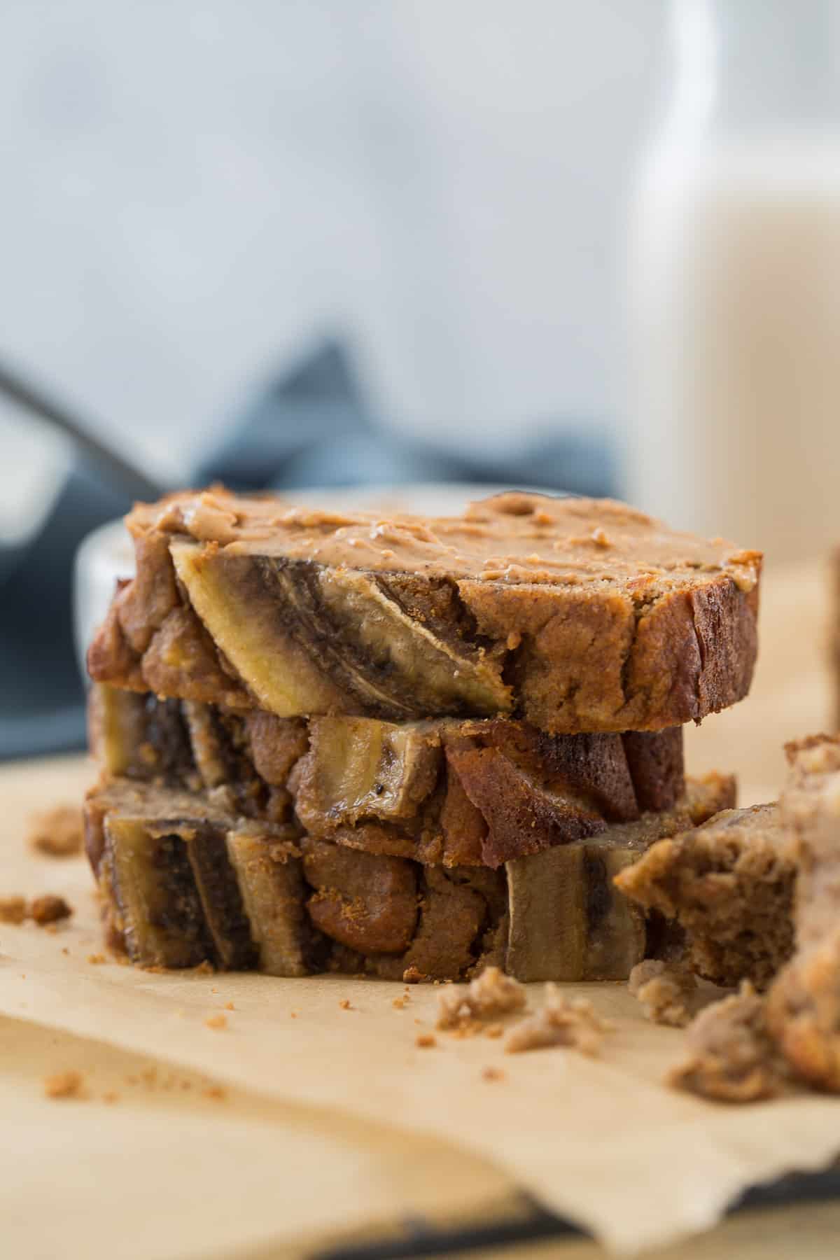 stacked sliced paleo banana bread topped with almond butter