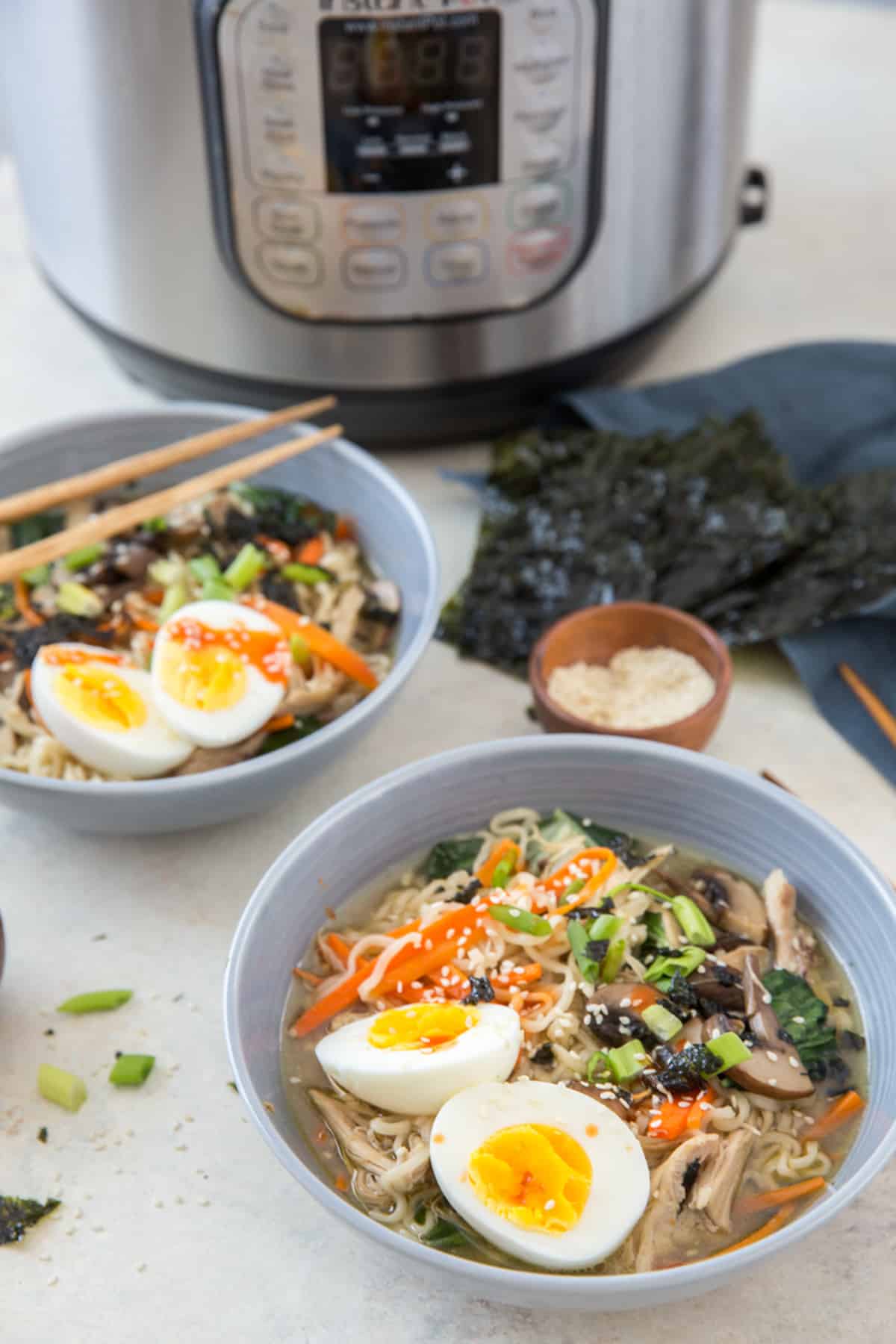 low sodium ramen in blue bowls with nori and instant pot in background