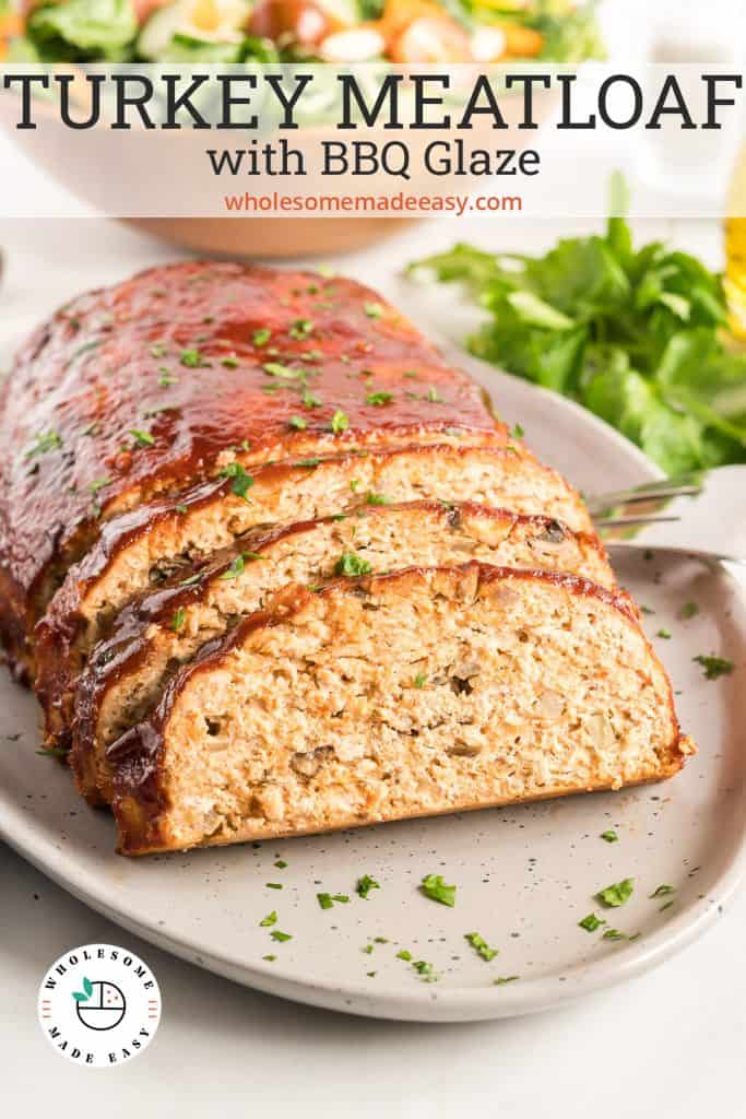 A sliced turkey meatloaf on a white platter with text overlay.