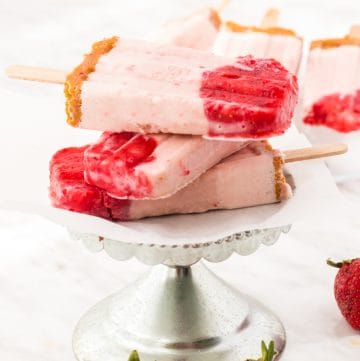 stack of strawberry cheesecake popsicles