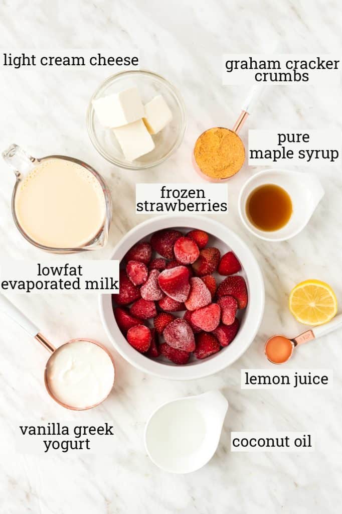 ingredients for strawberry cheesecake popsicles on table