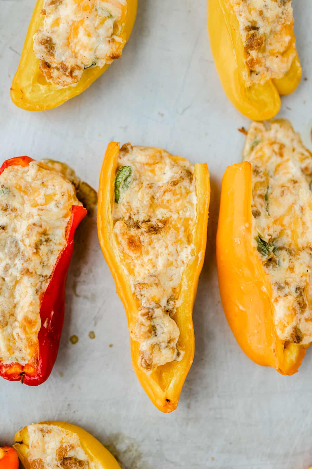 A close up of mini peppers stuffed with cream cheese and chorizo.