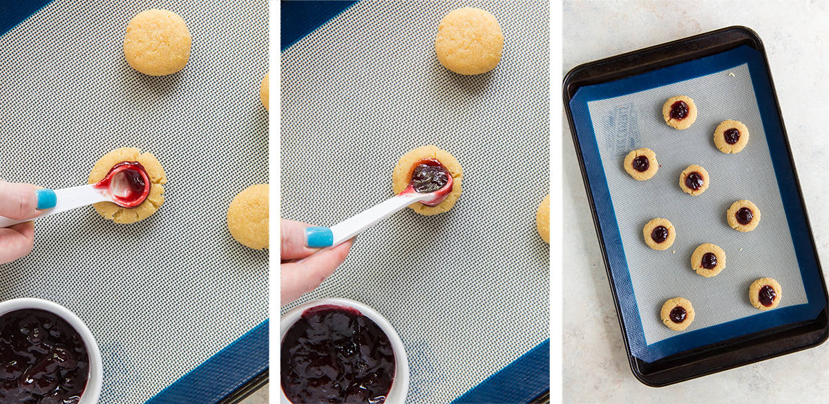 A measuring spoon fills a thumbprint cookie with raspberry preserves.