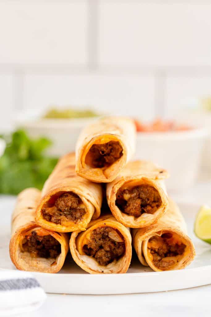 Stacked Beef Taquitos shot from the side.