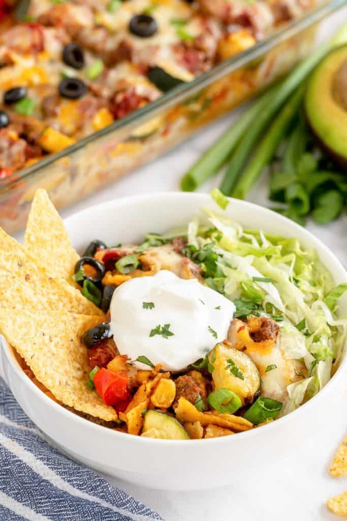 A serving of Taco Bake in a bowl with toppings.