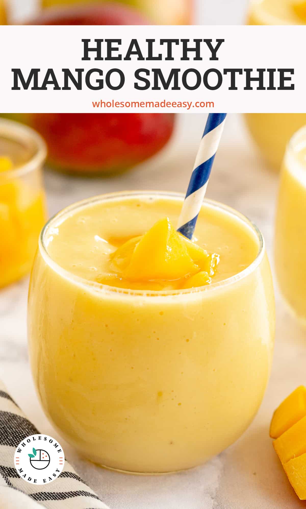 A mango smoothie in a glass cup with a blue straw with text overlay.