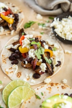 Mushrooms, peppers and onions on a flour tortilla with cotija cheese and cilantro.