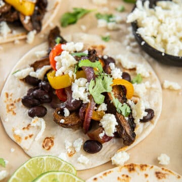 Mushrooms, peppers and onions on a flour tortilla with cotija cheese and cilantro.
