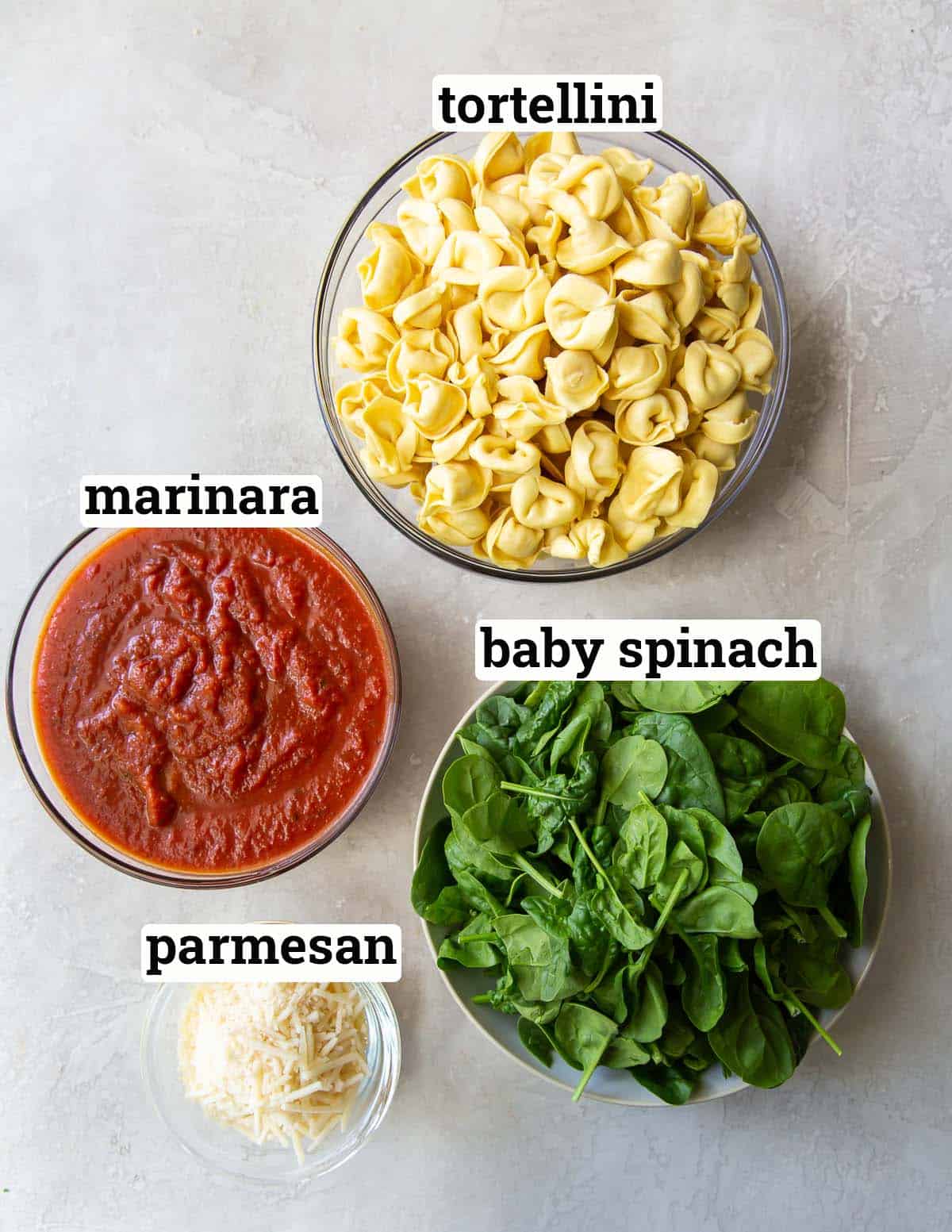 The ingredients to make Spinach Parmesan Tortellini Bake