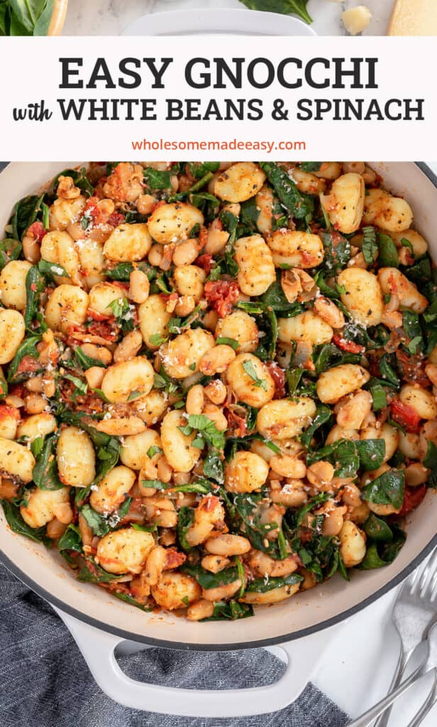 A skillet filled with Gnocchi with White Beans and Spinach with overlay text.