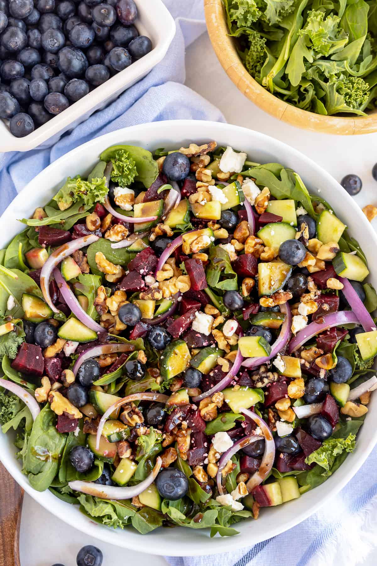 A top down shot of a blueberry beet salad with balsamic dressing.