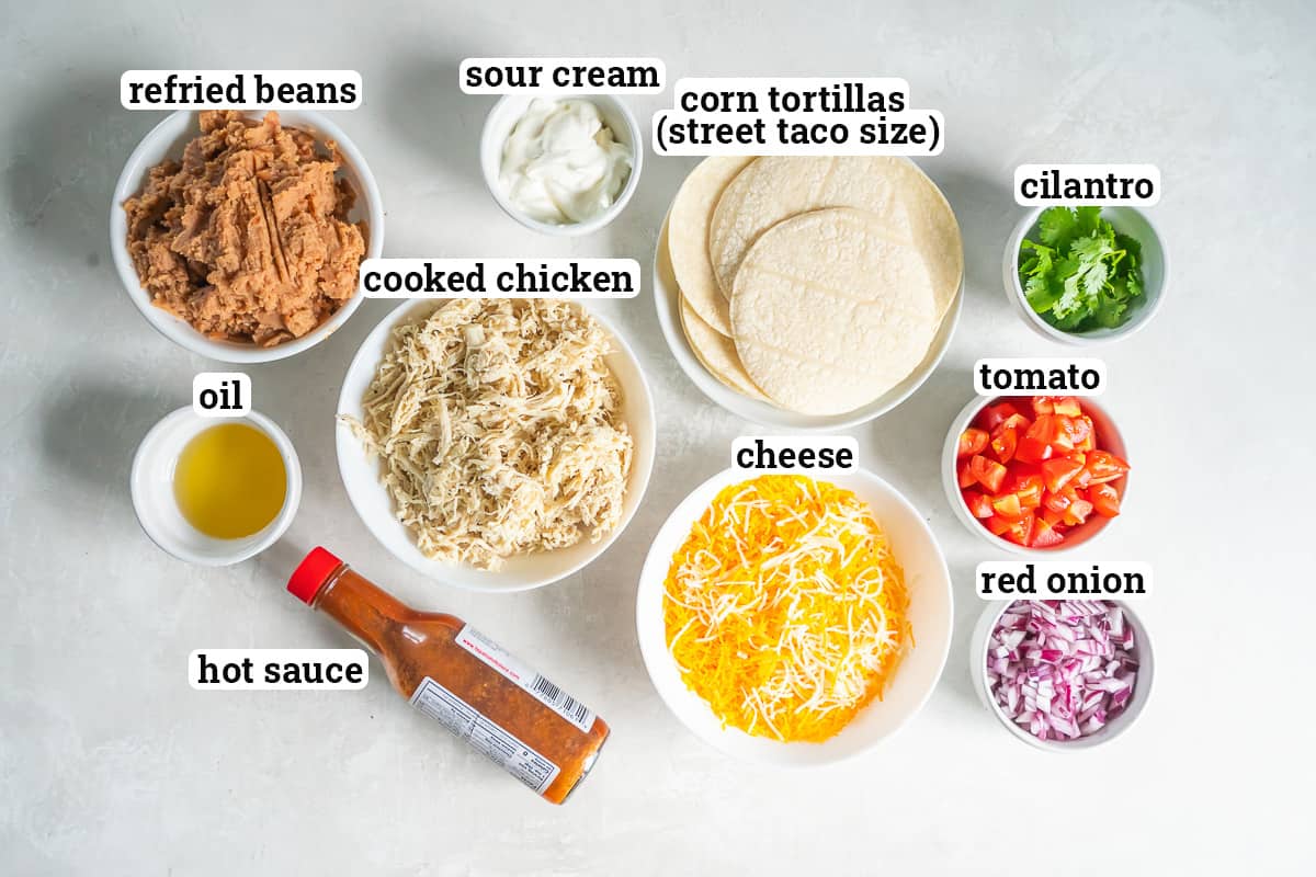 Tortillas, chicken, and other ingredients to make mini tostadas with text.