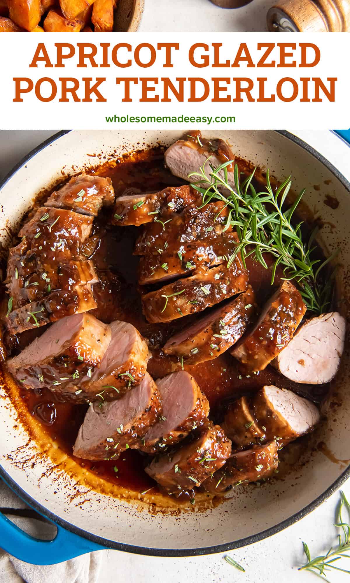 A top down shot of slices of Apricot Glazed Pork Tenderloin in a pan with sprigs of fresh rosemary.