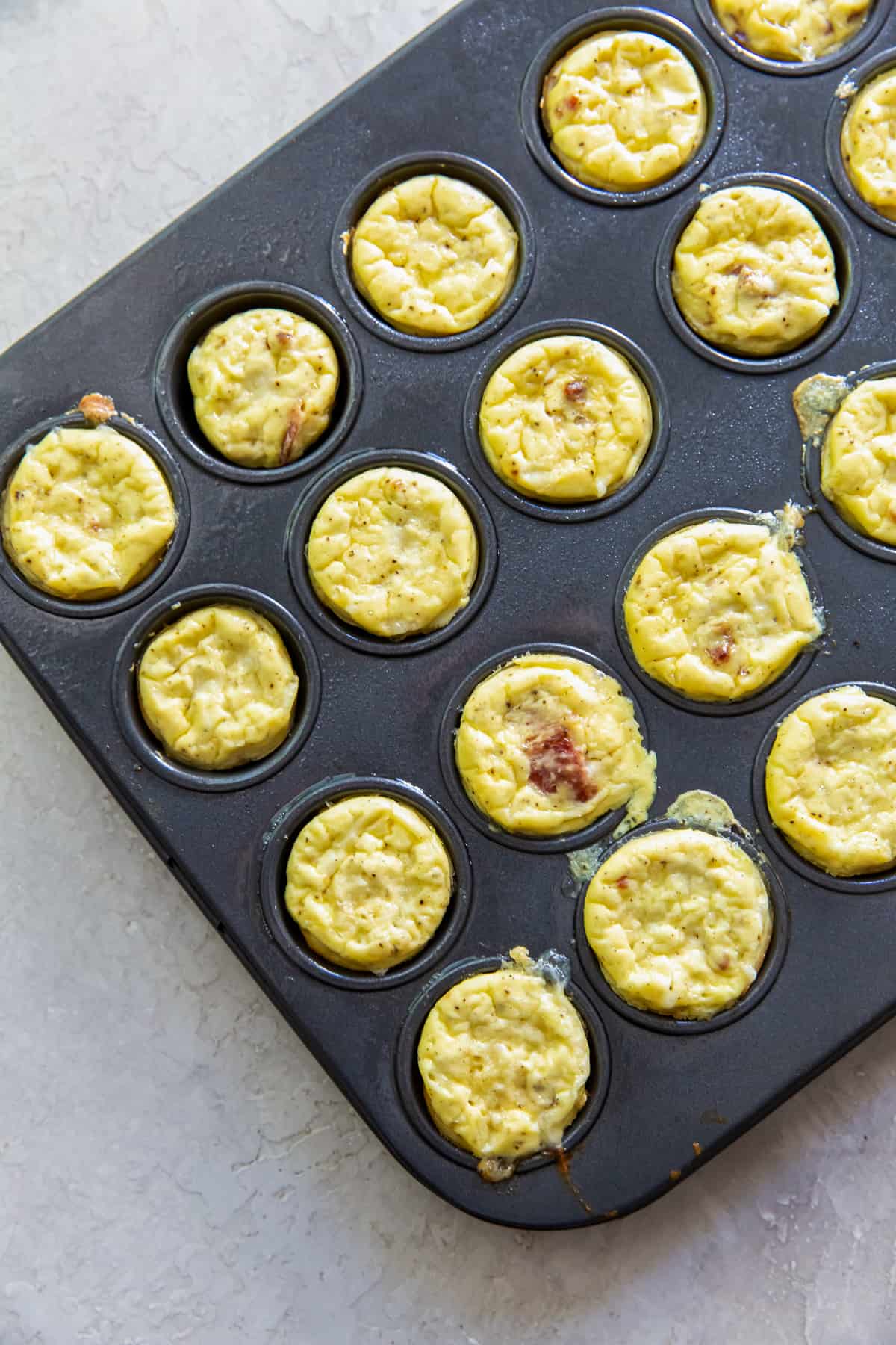 A top down shot of egg bites in a mini muffin pan.