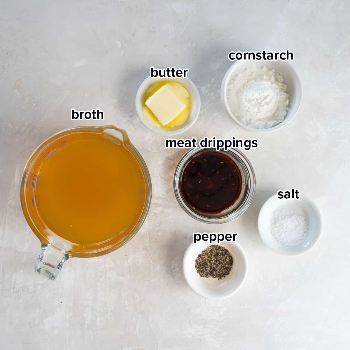 Broth, cornstarch, and other ingredients for gluten free gravy with text.