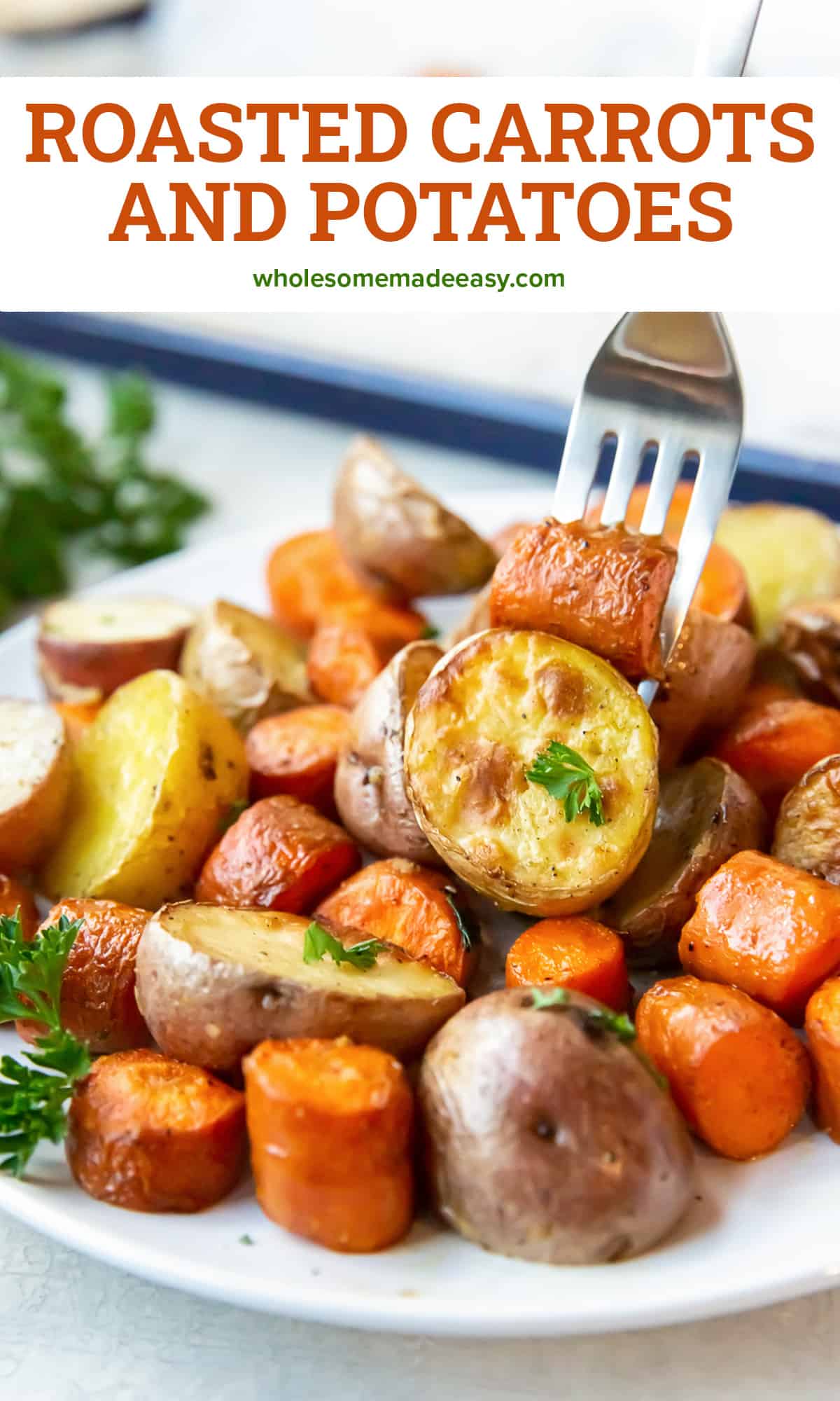 A fork piercing a potato and carrot on a plate filled with roasted vegetables with text.