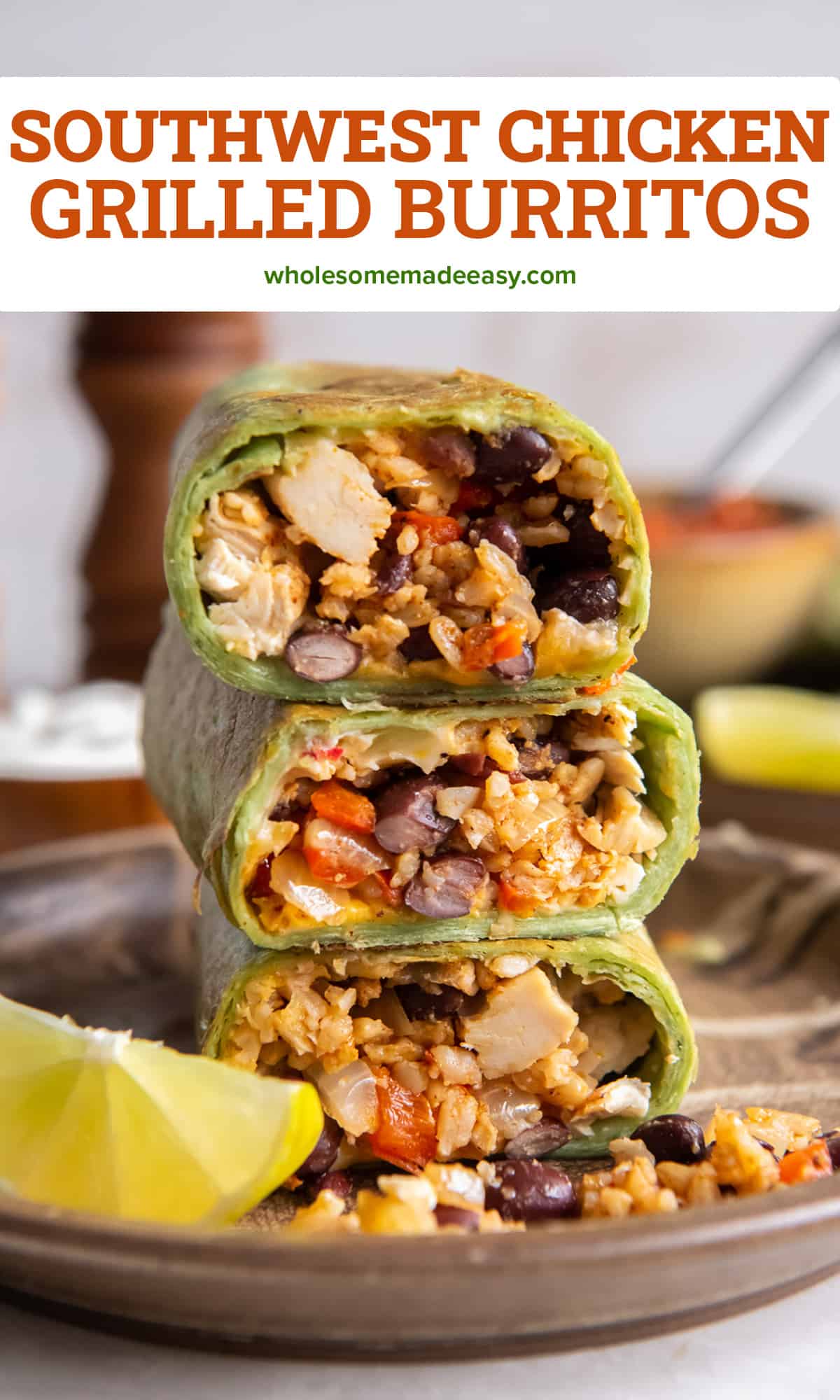 A stack of halved burritos in green tortillas revealing the filling of rice, black beans, red bell peppers, and chicken with text.