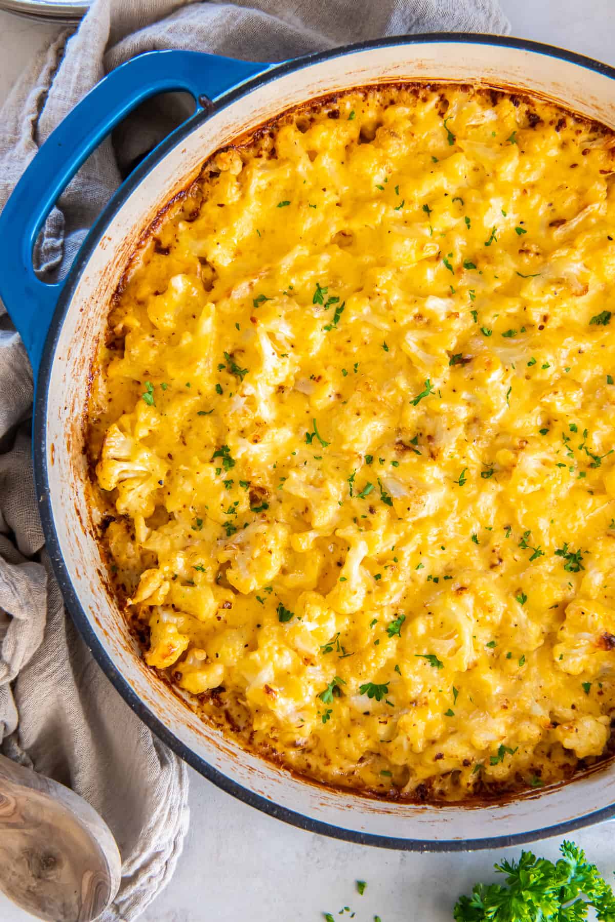A top down shot of cauliflower mac and cheese in a skillet.