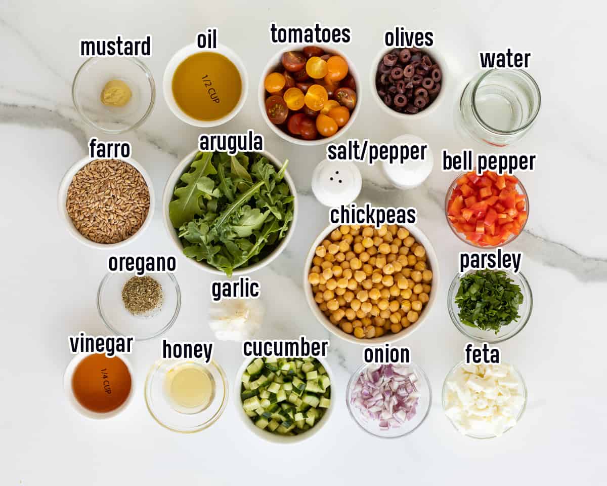Farro, arugula, chickpeas and other ingredients in bowls with text.