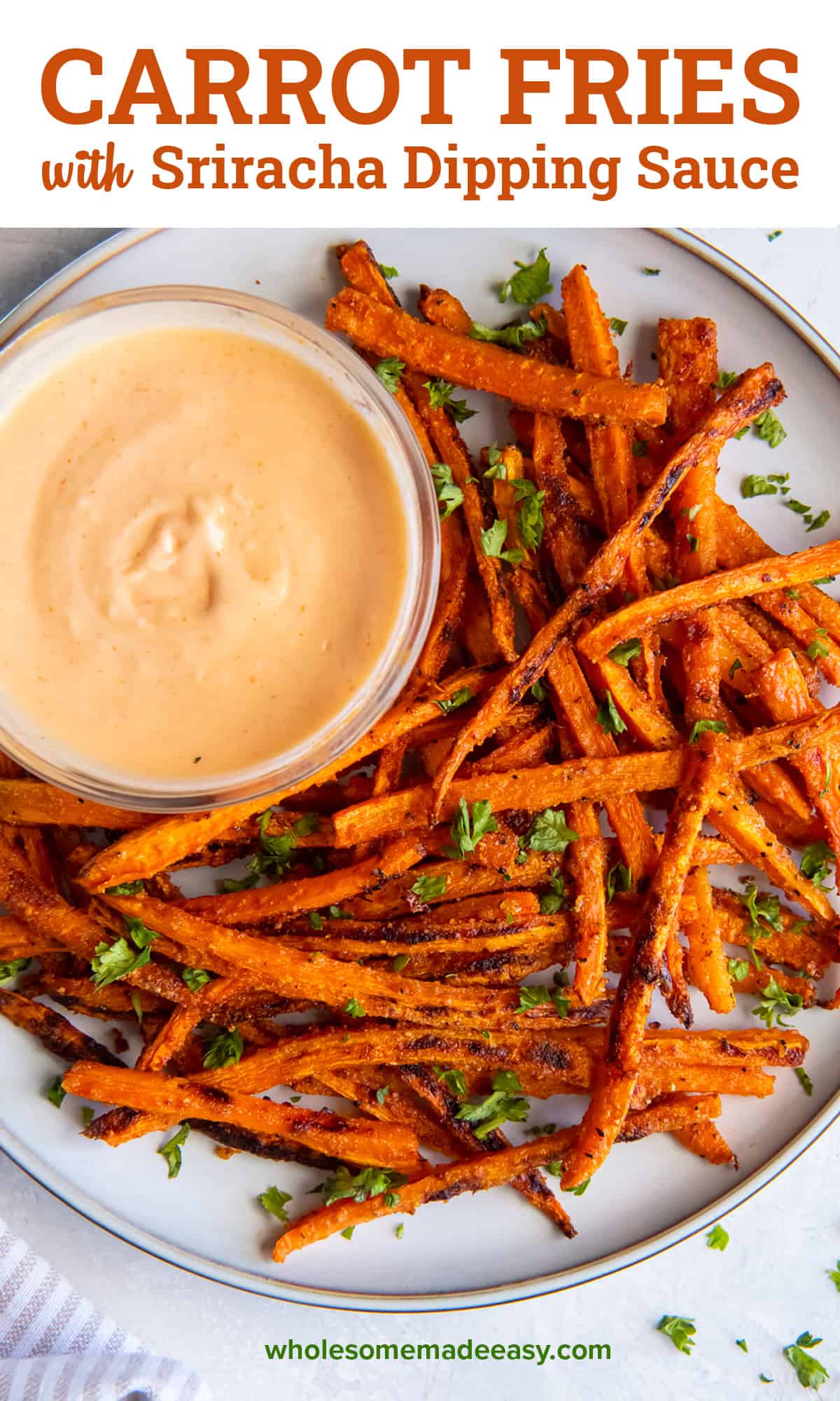 A top down shot of carrot fries on a plate with a small bowl of sriracha honey dipping sauce with text.