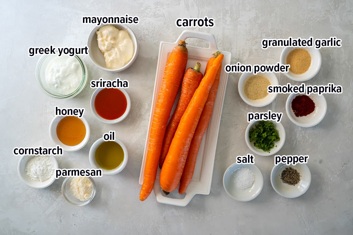 A top down shot of carrots on a small plate surrounded by other ingredients with text.