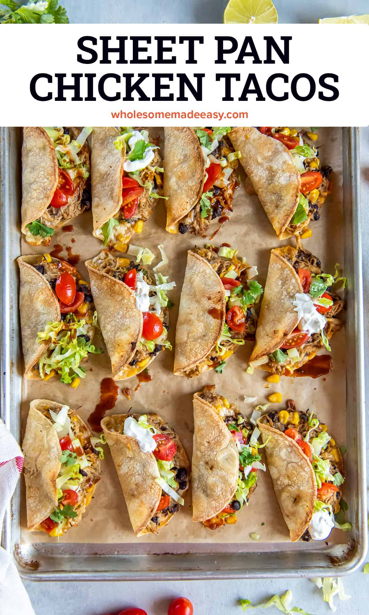 A sheet pan full of chicken tacos filled with lettuce, tomatoes, and sour cream with text.
