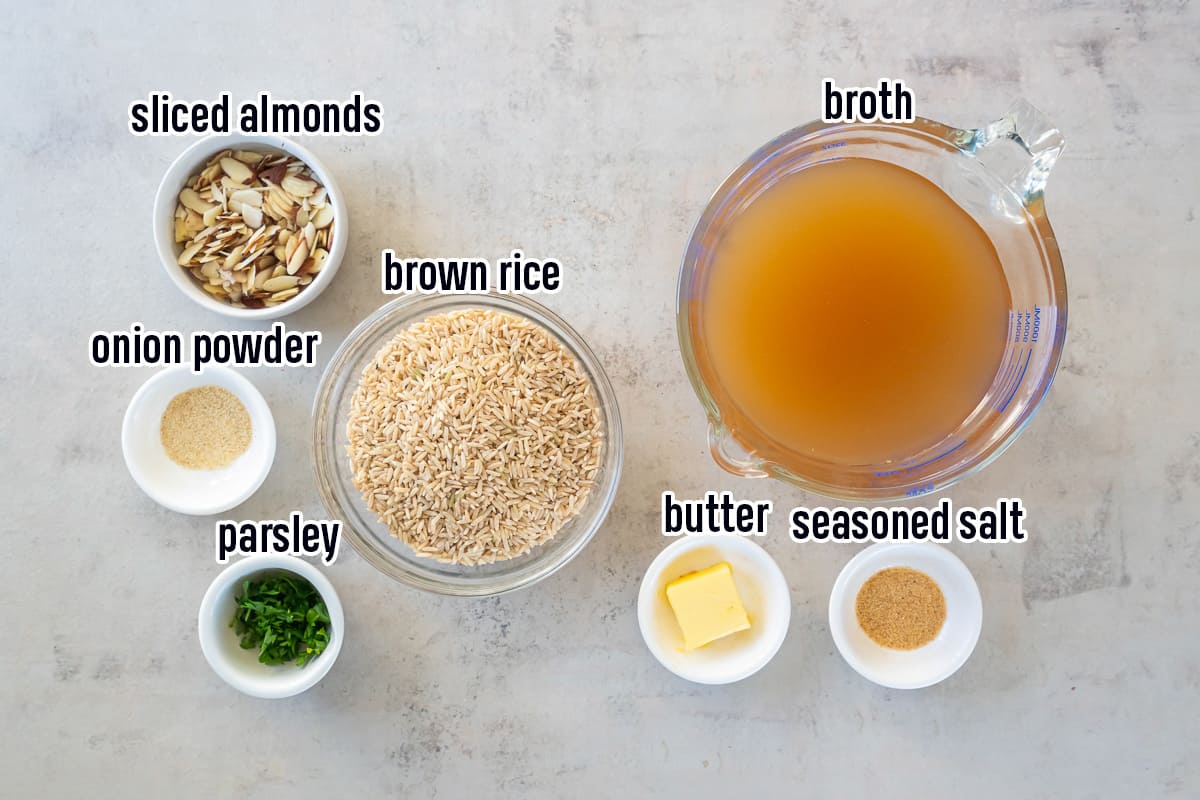 Brown rice, broth, almonds, and seasoning in bowls with text.