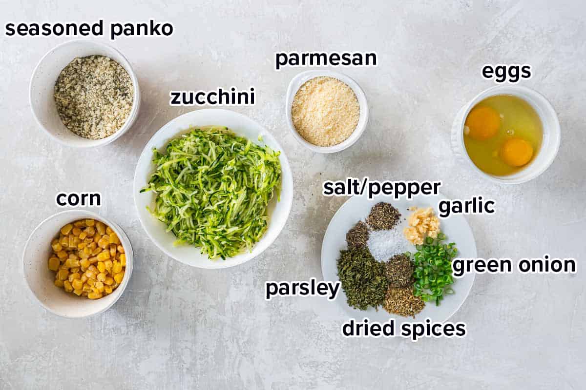 Shredded zucchini, panko, Parmesan, and other ingredients in bowls with text.