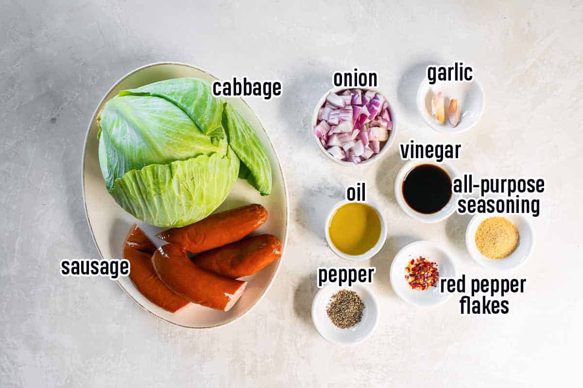 Cabbage, sausage, and other ingredients in bowls with text overlay.