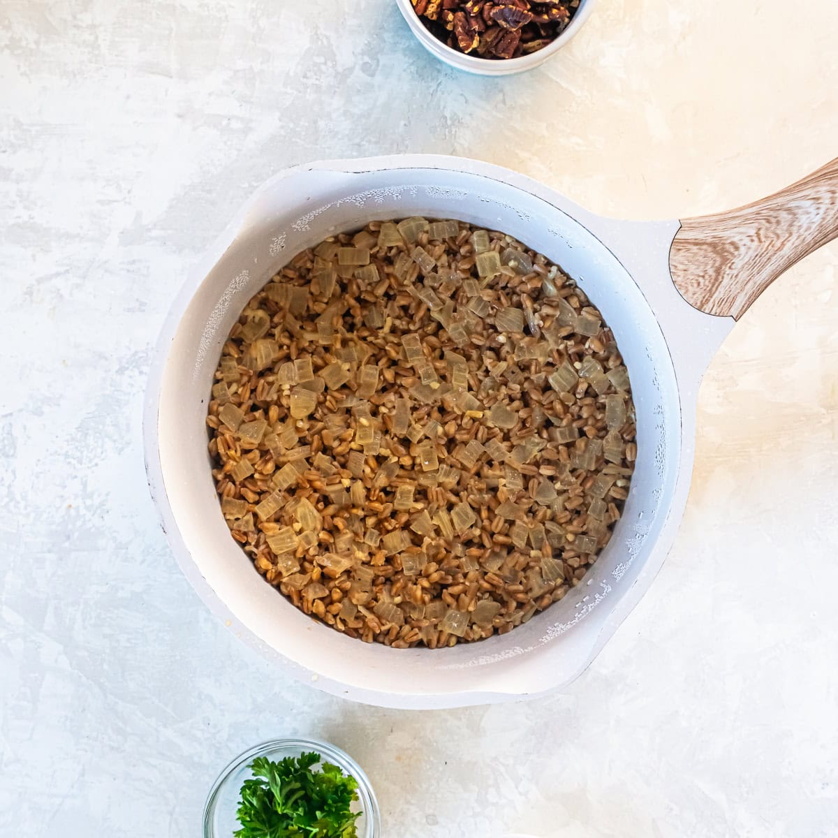 The farro after cooking in the saucepan.