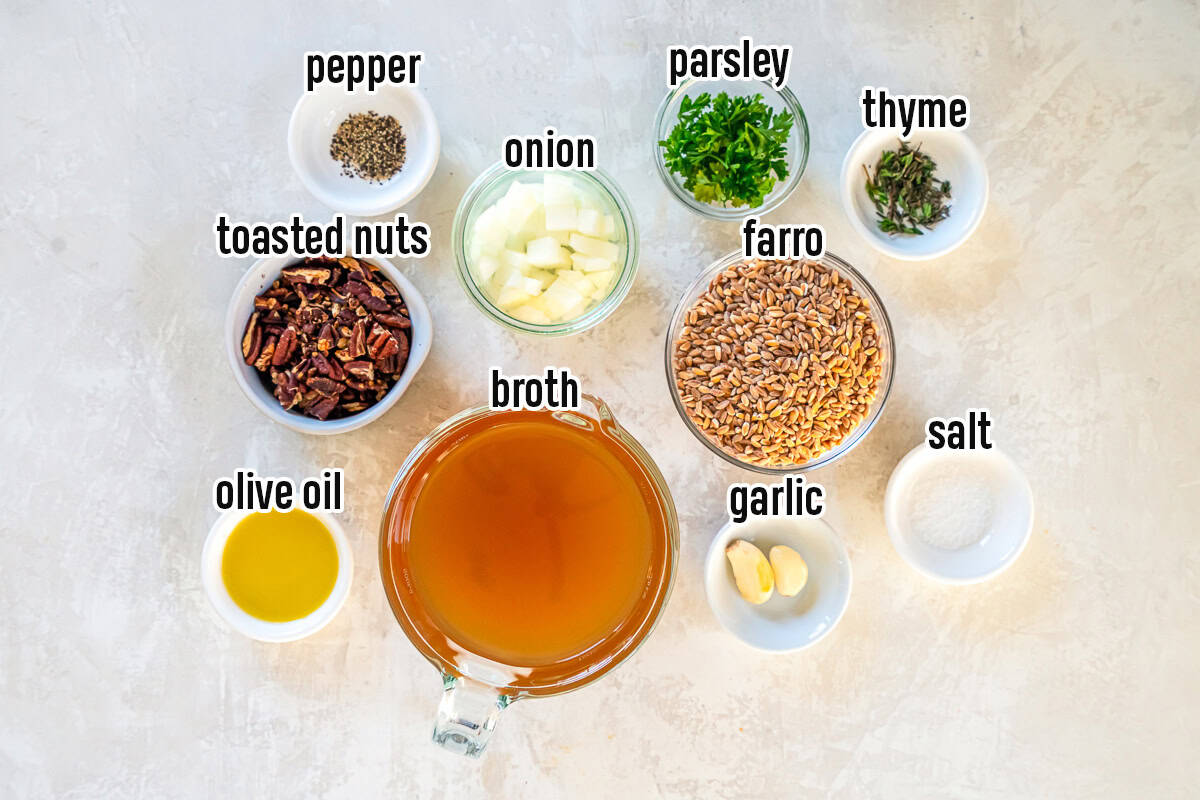 Ingredients for farro pilaf including farro, broth, toasted nuts and more with text overlay.