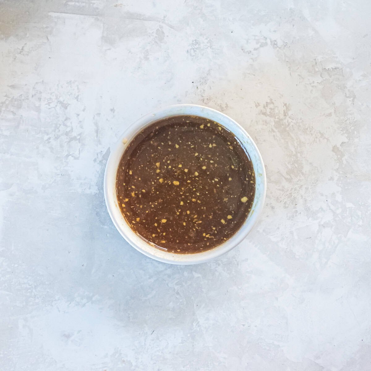 Maple syrup and Dijon mustard whisked together to make a maple glaze for turkey.