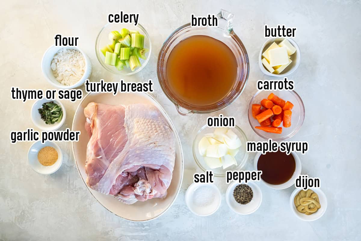 Ingredients for maple-glazed bone-in turkey breast including raw turkey breast, chicken broth, butter, onion, carrots, celery, maple syrup, Dijon mustard, flour, salt, pepper, garlic powder, and fresh thyme.
