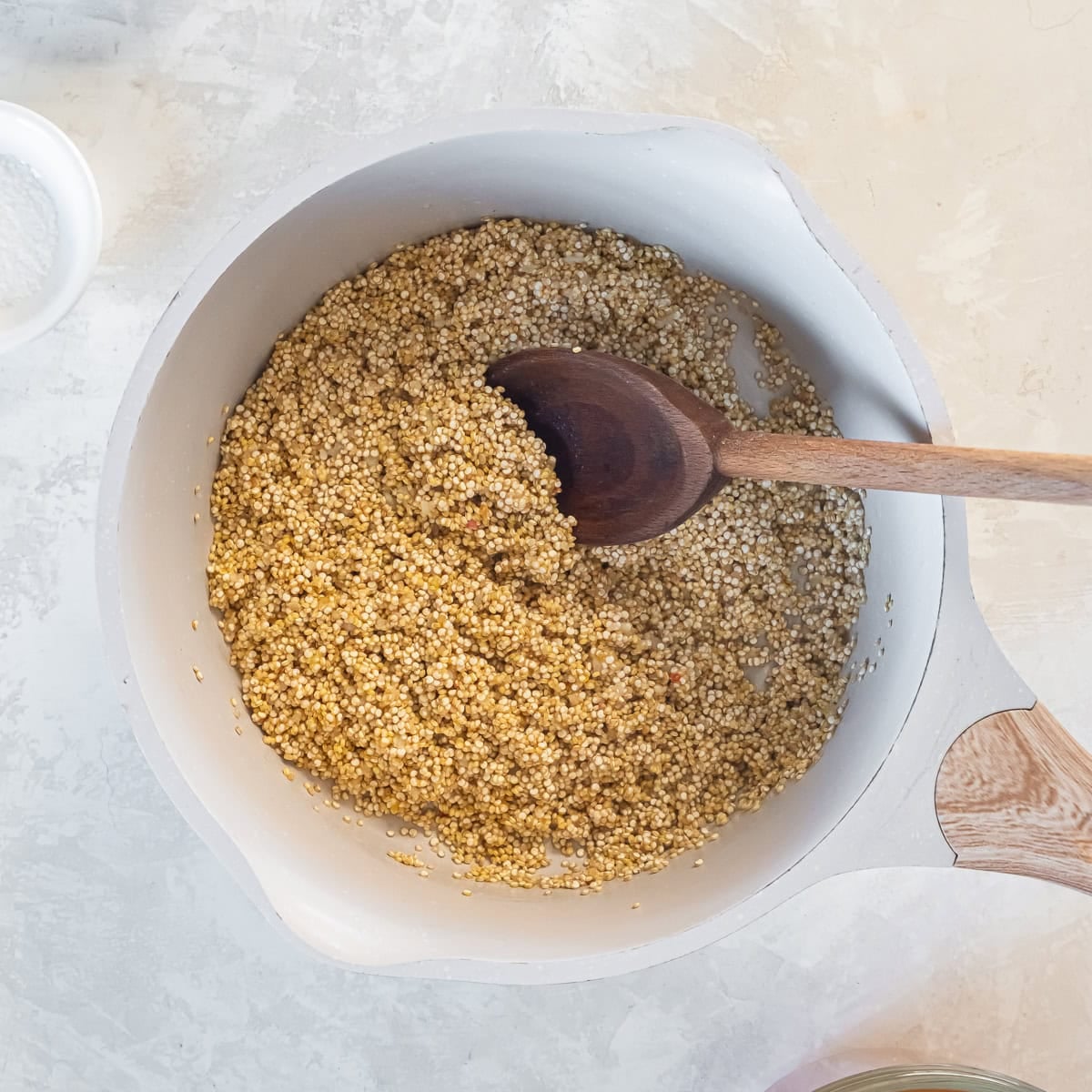 Rinsed quinoa added to the pan and lightly toasted witha garlic and butter.