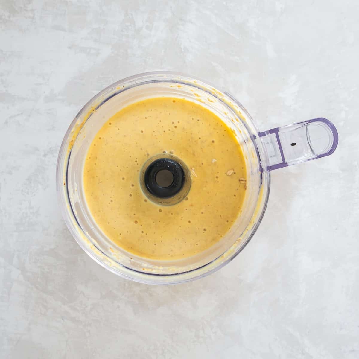 Smooth batter for cottage cheese pancakes after blending oats, eggs, and cottage cheese.