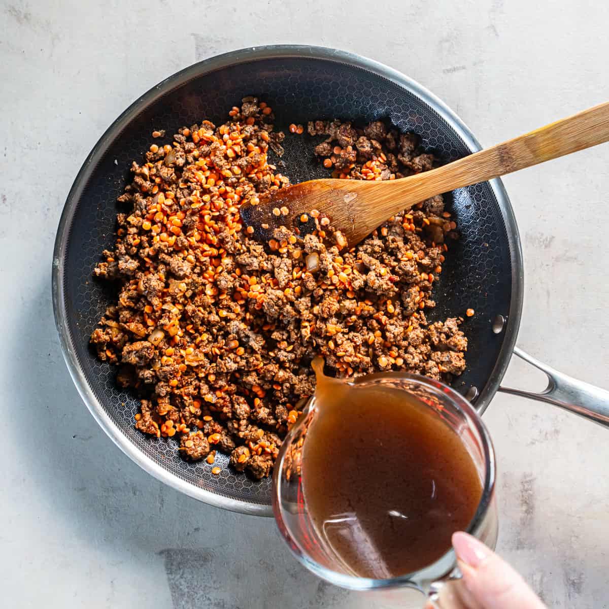 Ground beef taco meat with red lentils cooked until the lentils are tender and the liquid has been absorbed.